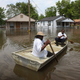 Residents evacuate flooded areas. (Getty Images)